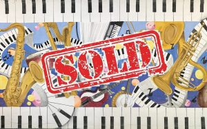 instruments and piano keys with sold stamp
